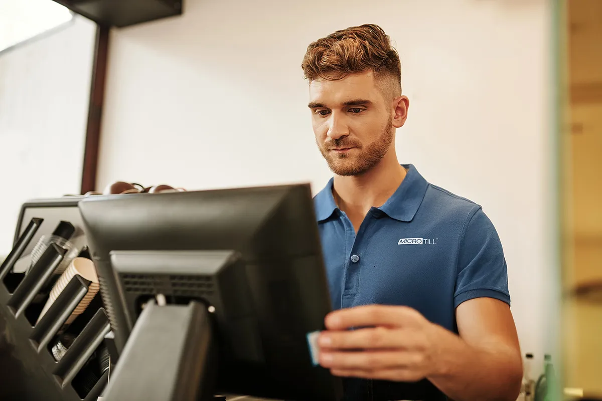 Microtill team member setting up an EPOS till